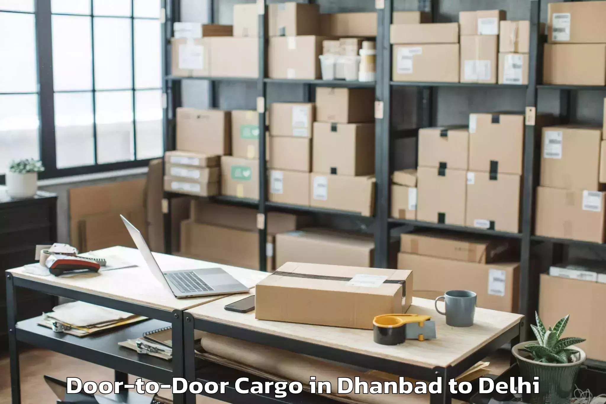 Dhanbad to Unity One Mall Janakpuri Door To Door Cargo Booking